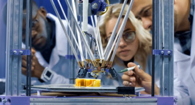 Researchers looking at a high tech innovation