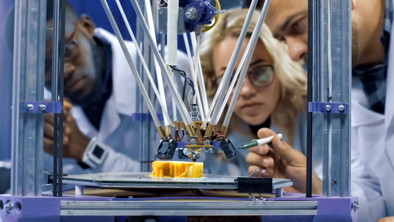 Researchers looking at a high tech innovation